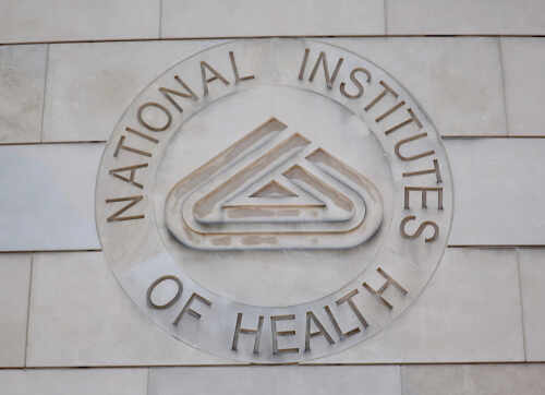 Signage of the National Institutes of Health on a building wall
