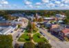 Regulations Crush American Dream of Ownership Aerial view of a small town square with park and flagpole