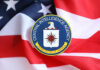 Agency Power Grab? JFK Files Disappear! CIA emblem displayed on an American flag background