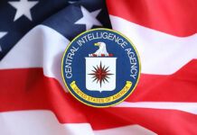 Agency Power Grab? JFK Files Disappear! CIA emblem displayed on an American flag background