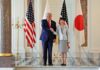 Surprising US-Japan Military Moves Unsettle Critics Two political leaders shaking hands in front of flags