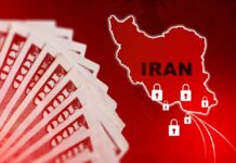 A stack of hundred dollar bills with a map of Iran and padlocks
