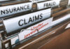 Massive Medicare Scam: Ex-NFL Player Busted Folders labeled with insurance terms, highlighting a claim under investigation