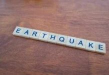 Monster Quake Triggers Panic Evacuations Scrabble tiles spelling earthquake on a wooden table