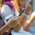 Judges Greenlight Teen TikTok Lockdown Hands of young people using smartphones