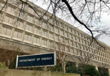 America’s New Reactor Hits Milestone Exterior view of the Department of Energy building with a sign and surrounding trees
