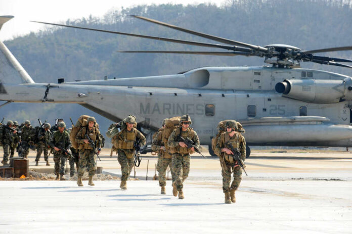 Us,Marine,Corps,And,South,Korea,Marine,Corps,Soldiers,Participating Marines in combat gear walking towards a helicopter