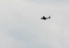 Eight Americans Lost In Fiery Crash An airplane flying in a cloudy sky