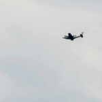 Eight Americans Lost In Fiery Crash An airplane flying in a cloudy sky