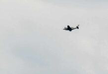Eight Americans Lost In Fiery Crash An airplane flying in a cloudy sky