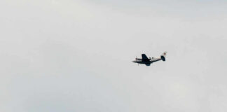 An airplane flying in a cloudy sky