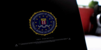 Close-up of a computer screen displaying the FBI logo and a security warning
