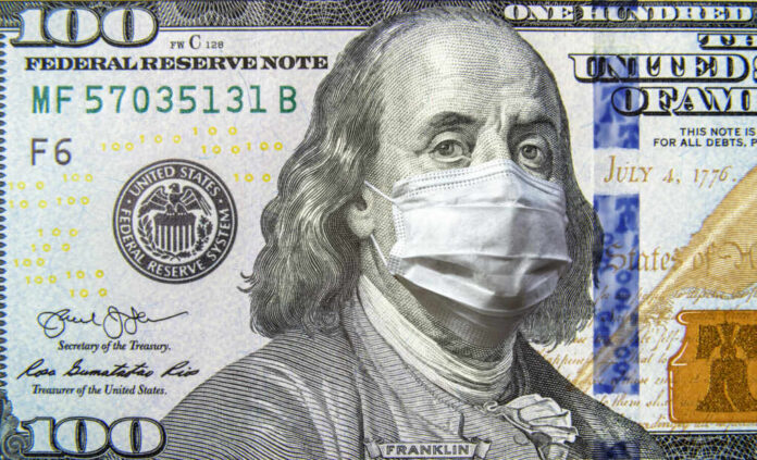 A hundred dollar bill featuring Benjamin Franklin wearing a face mask