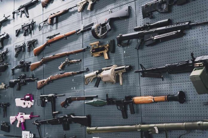 Collection,Of,Rifles,And,Carbines,On,The,Wall Wall display of assorted firearms and weapons