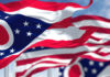 Ohio Fraud Claims Spark Firestorm Waving Ohio state flags against a blue sky