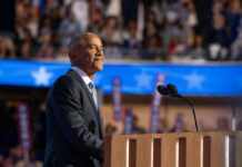 The Line Between Science, Ukraine and Obama A speaker at a podium addressing an audience during a political event