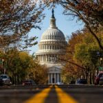 U.S. Capitol dome framed by a tree-lined street
