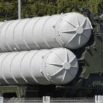 Russia’s Arms Grip SHATTERS Close-up of a military missile system with cylindrical launchers