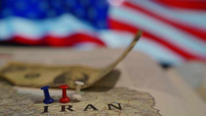 Bosnia,And,Hercegovina,,Travnik,,13.01.2025:,Concept,Of,America,And,Iran Map of Iran with push pins and a dollar bill in front of an American flag