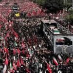 Iran’s Delayed Funeral Sparks Debate Massive funeral procession with coffins on a vehicle amid a sea of mourners