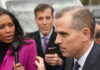 A journalist interviewing a political figure outdoors