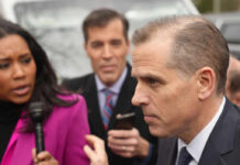 A journalist interviewing a political figure outdoors