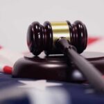 Judge’s gavel on a base over an American flag