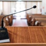 Podium with microphone and Bible in a church