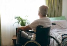Decades-Old Drug Delivers New Hope older man in a wheelchair looking out a bright window