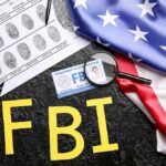 FBI Nabs ‘Most Wanted’ COVID Grifter FBI letters with fingerprint sheet, badge, magnifying glass, and US flag