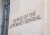 Office of the Attorney General building sign on stone wall