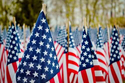 Sea,Of,American,Flags,Set,Up,During,An,American,Holiday, Field of American flags waving in the breeze