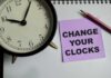 Daylight Saving Bill Advances In Congress Alarm clock and note on a desk