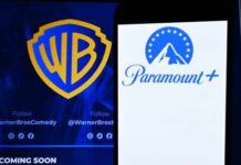 States Revolt Against Hollywood Mega-Merger Logos of Warner Bros and Paramount Plus displayed on a screen
