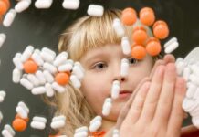 Senator Targets Plan C Over Abortion Pills A child observing colorful pills floating in the air