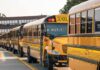 School Trip Sparks Religion Uproar Row of yellow school buses parked outside a brick school