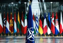 Top General: NATO Dream Is Dead NATO flag with member country flags in the background