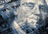close-up of a US hundred-dollar bill portrait and microprint details