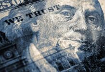 close-up of a US hundred-dollar bill portrait and microprint details