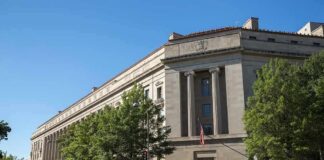 Neoclassical government building with columns and flag