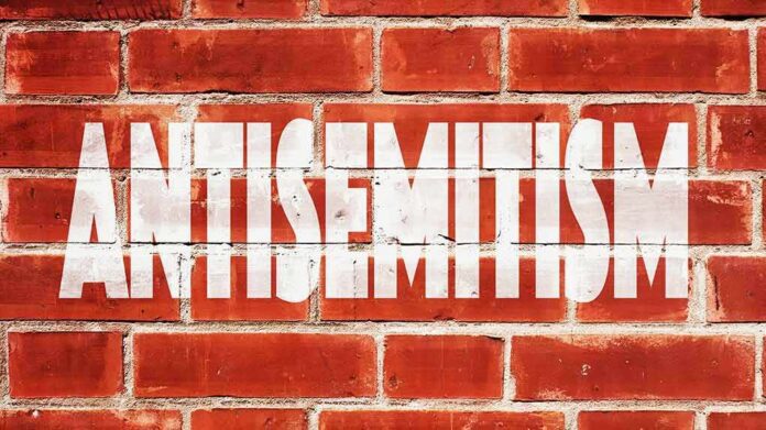 shutterstock_473788954 Brick wall with large white stencil text