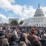 Capitol Scramble Over Soaring Bills Large crowd gathered in front of the United States Capitol