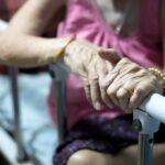 Grandma’s Final ‘Consent’ Disputed Elderly person’s hands resting on a hospital bed rail