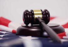 Illinois Gamble Triggers Nun Revolt Judge’s gavel on a base over an American flag