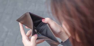 Hands holding an open empty wallet