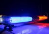 Viral Melee Ignites Crackdown Near Campus Police car light bar flashing blue and red at night