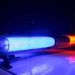 Viral Melee Ignites Crackdown Near Campus Police car light bar flashing blue and red at night