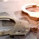 Teen Gunman Caught Minutes After Carnage Handcuffs on a fingerprint form