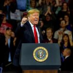 Media Whiplash Over Fetterman–Trump Bond man speaking at a podium during a rally