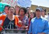 Rashida Tlaib speaks at a podium with Ayanna Pressley and Joaquín Castro beside her; Pete Aguilar behind